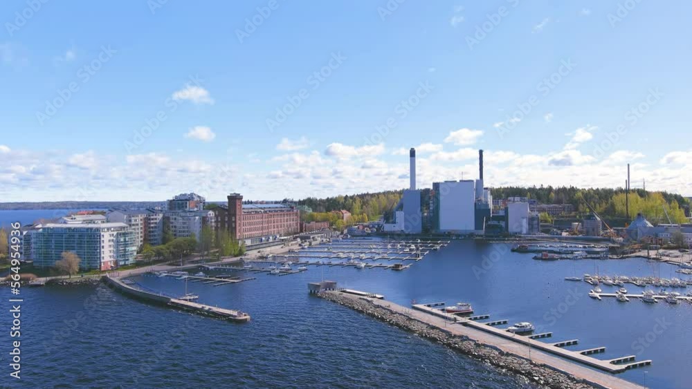 Tampere, Finland: Aerial view of Nordic city in spring, dark waters of adjacent lake - landscape panorama of Northern Europe from above