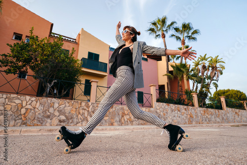 Stylish woman in roller skates