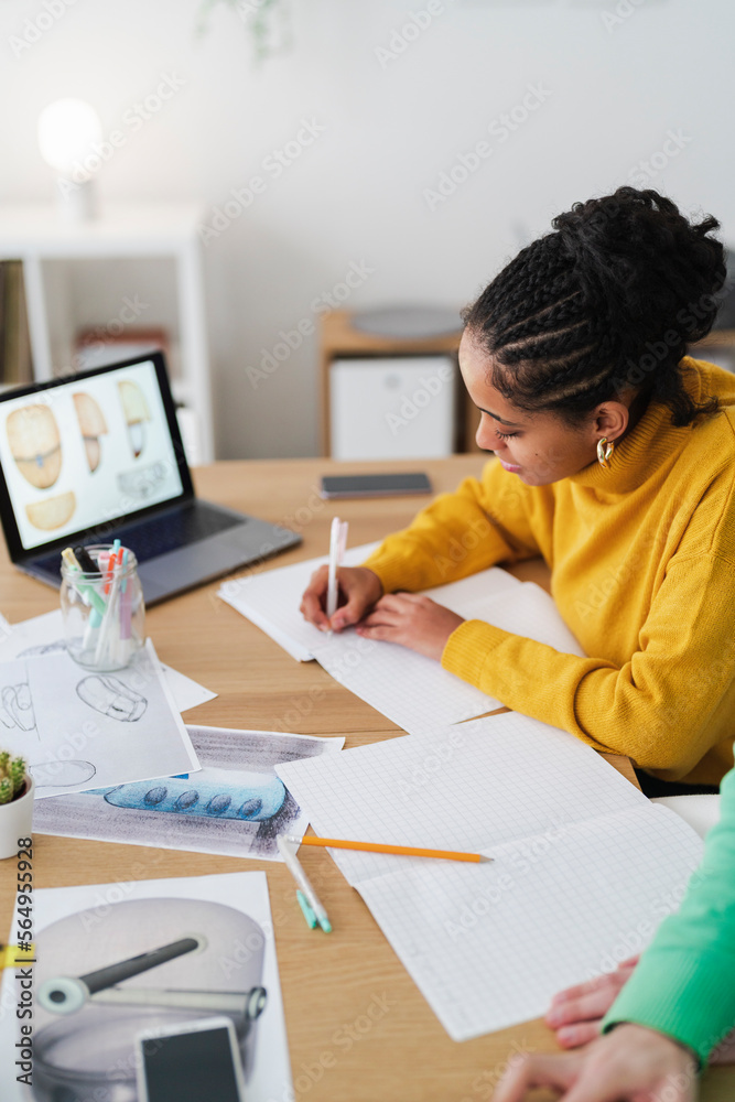 Focused boy doing paperwork at home Focused boy doing paperwork at home