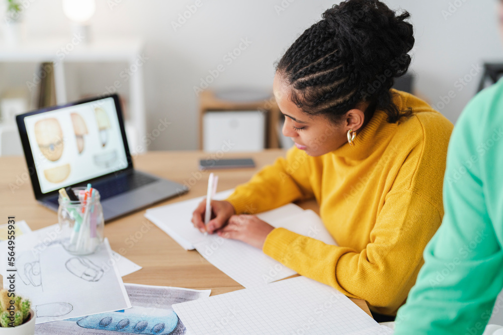 Focused boy doing paperwork at home Focused boy doing paperwork at home