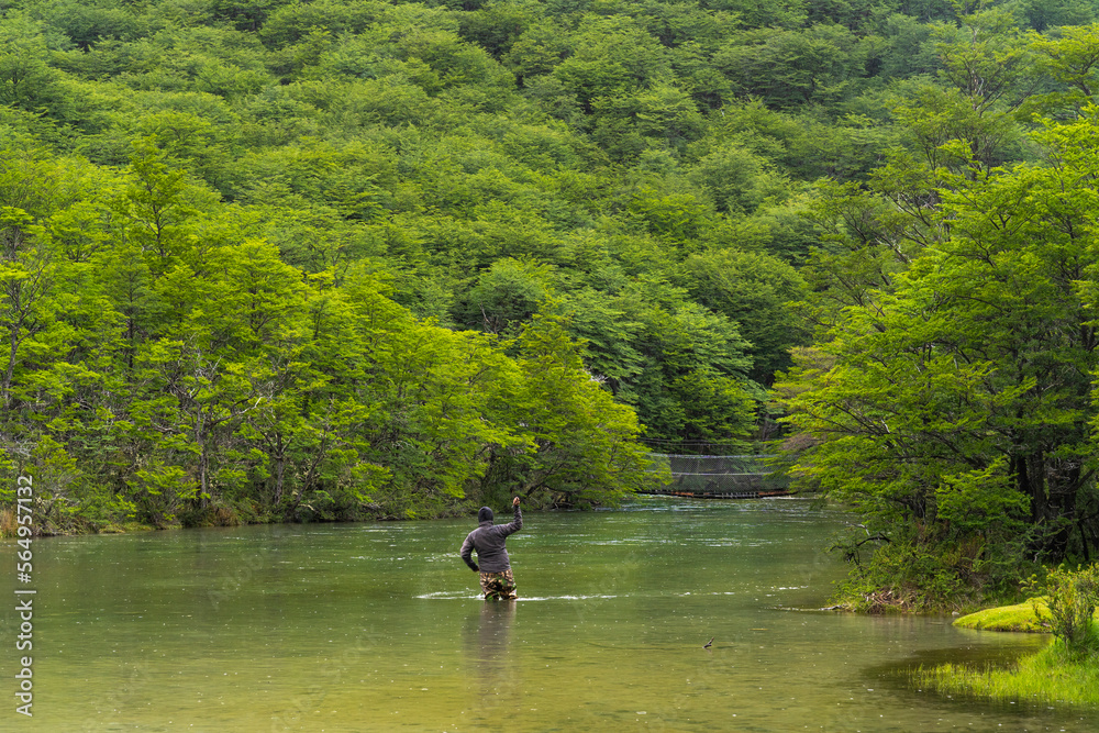 Unrecognizable Man Fishing On The Bank Of A River, Argentina Unrecognizable Man Fishing On The Bank Of A River, Argentina