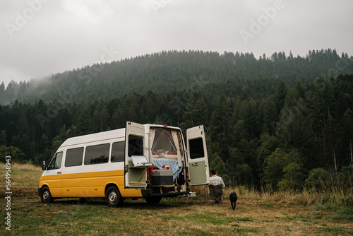 Camper van caravan in forest  photo