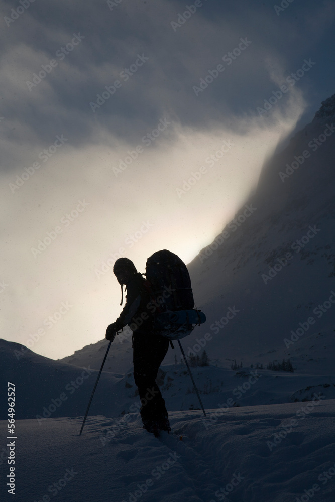 Silhouette of a back country skier in the mountains. Silhouette of a back country skier in the mountains.