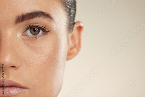 Beauty, skincare and half face of woman on mockup space for cosmetics, makeup and facial products. Spa aesthetic, dermatology and portrait of girl with glowing skin, self care and wellness in studio