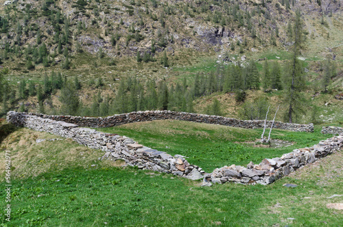 Rural life. Stone fence ( known as barech ) for cattle in the mountains . photo