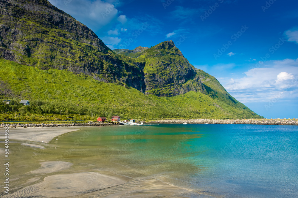 The crystal clear water of the Ersfjordstranda beach in Senja Island,  Norway