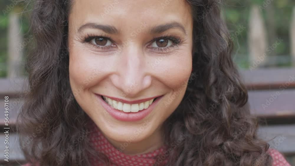 super close-up on the face of a beautiful young woman of Hispanic ethnicity with beautiful smile and captivating look super close-up on the face of a beautiful young woman of Hispanic ethnicity with beautiful smile and captivating look