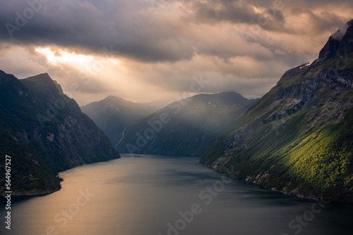 Dramatic sunbeam from the clouds over the Geirangerfjord, Norway