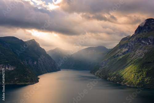 Dramatic sunbeam from the clouds over the Geirangerfjord, Norway