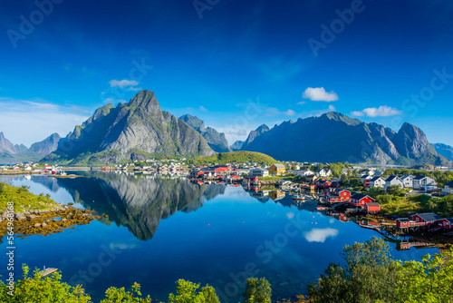 Perfect reflection of the Reine village on the water of the fjord in the Lofoten Islands, Norway © Stefano Zaccaria