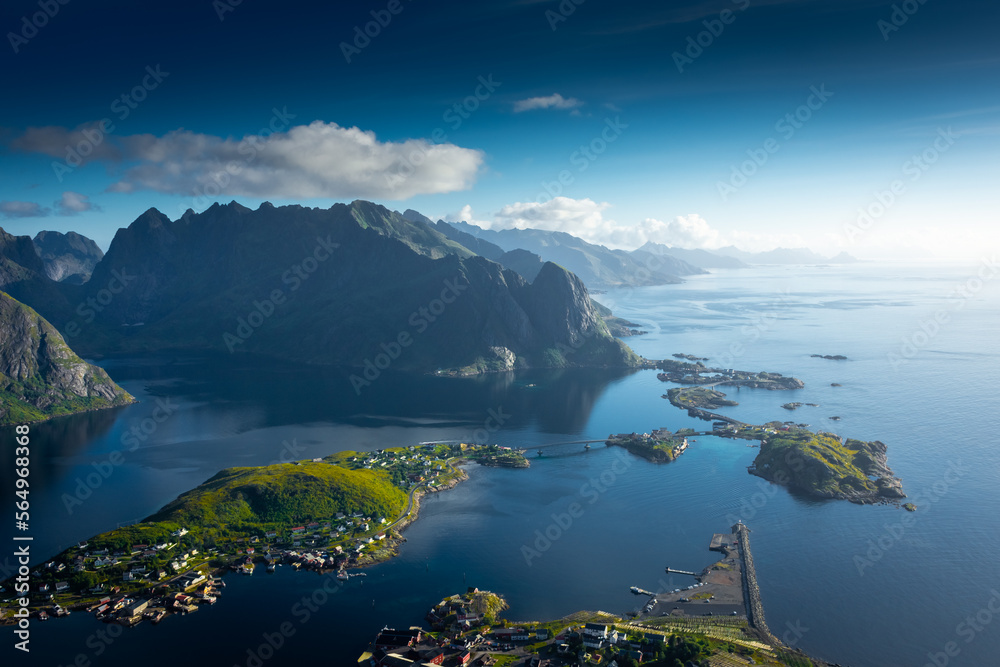 Amazing landscape of the Lofoten Islands from the top of Reinebringen Mountain with blue sky , Norway