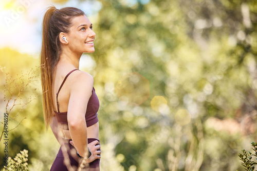 Wellness, fitness and woman in nature smile to enjoy fresh air after running, marathon training and workout. Sports, motivation and happy girl in park for zen wellness, cardio and healthy lifestyle