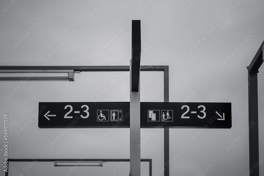 a signpost at a railroad station a signpost at a railroad station