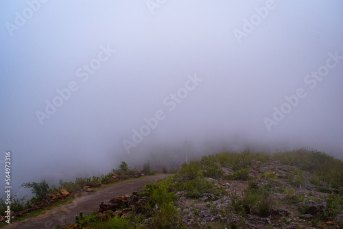 selective focus picture of mountains and clouds in the rainy season