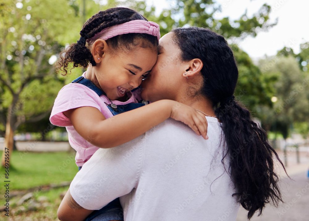 Fototapeta premium Mother, daughter and kiss in a park, love and sweet while bonding outdoor together. Black woman, girl and kissing face in a forest for fun, precious and happy, laugh and relax in moment of motherhood