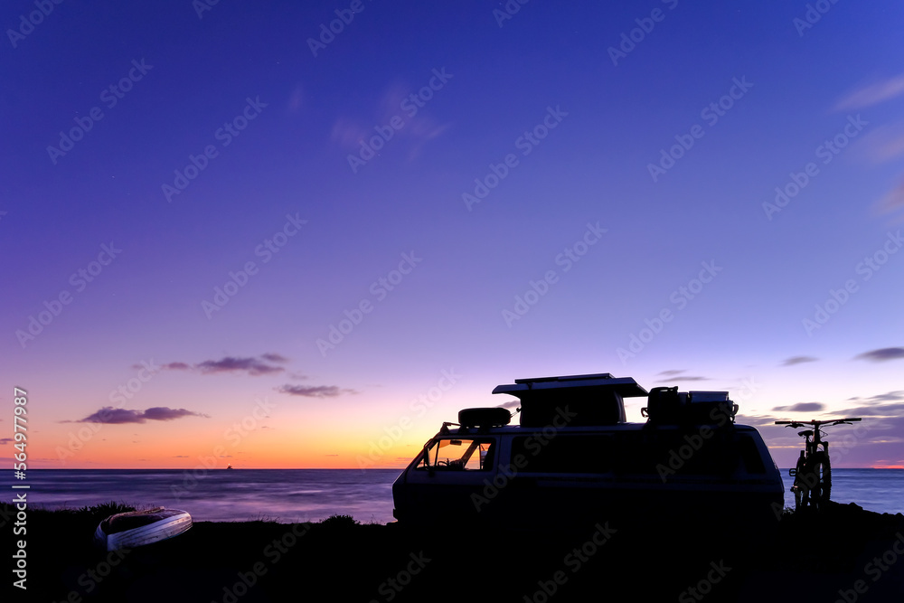 Old vintage van by the sea at sunset, Civitavecchia, Lazio, Italy