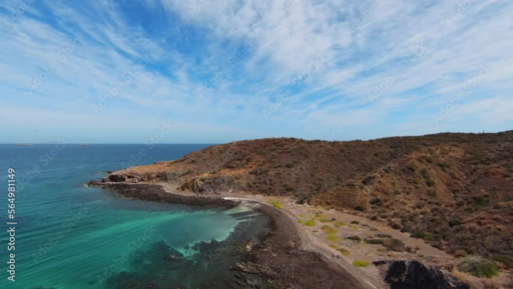 Aerial View Along Wild Seashore and Brown Hill Overlooking Turquoise Ocean in Region of Baja Mexico, Wilderness Landscape Aerial View Along Wild Seashore and Brown Hill Overlooking Turquoise Ocean in Region of Baja Mexico, Wilderness Landscape