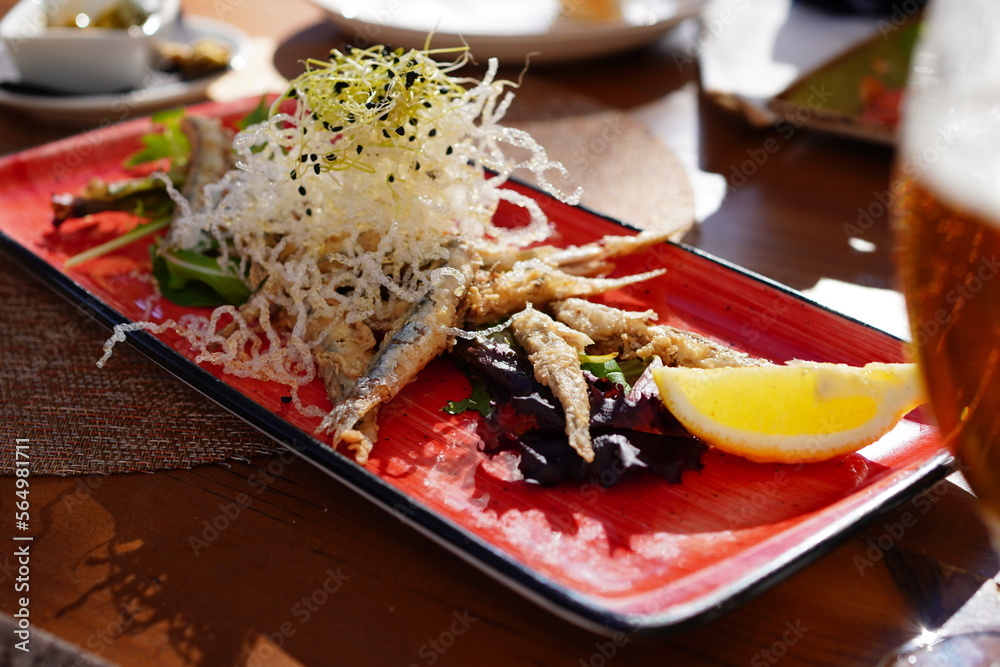 Boquerones fritos, typical Spanish tapas, Spanish fried anchovies Stock Photo Adobe Stock