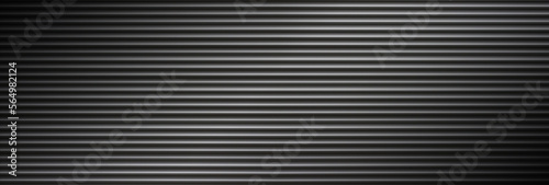aluminum metal shutter texture in the dark. Wide industrial modern background for design. Panoramic corrugated metal texture with copy space.