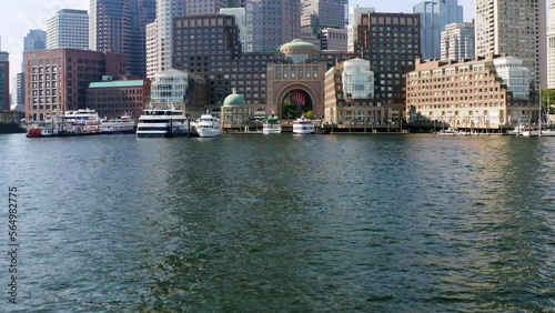Low drone shot approaching Boston skyline from Boston harbor