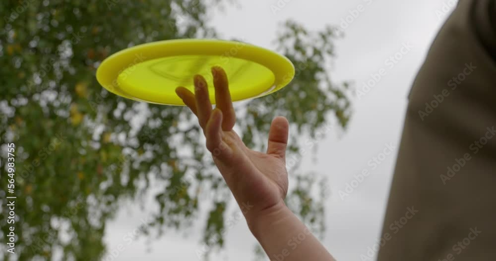 Disc golfer spinning the disc at finger tip