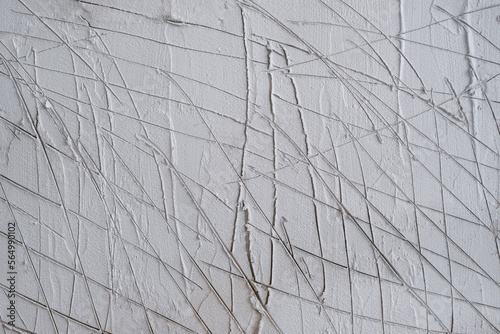 textured of scratched plaster wall, surface scratches for helps second coat of plaster to adhere scratch coat create a bond between the two layers