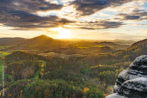 Sunset and foggy sunrise at the glass viewpoint in Jetřichovice. photo