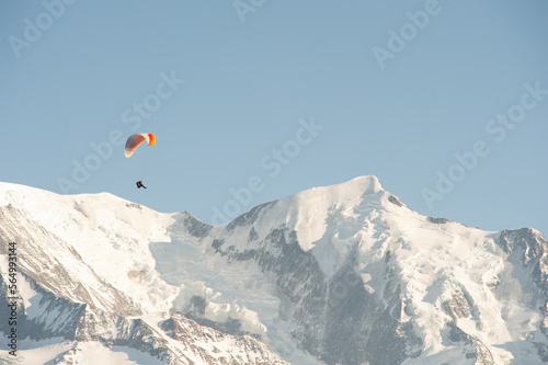 paraglider in the mountains with snow in winter