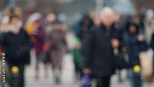 Wallpaper Mural Bokeh blurred people crowd walking crossing busy urban street slow motion, city life, lot of pedestrians crowded crosswalk, rush hour intersection sidewalk autumn day. Blurry cityscape background Torontodigital.ca