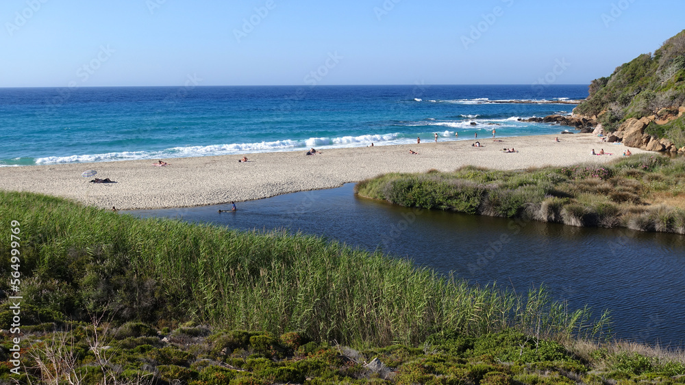 Paradise sandy bay and beach with river flowing to the sea of Mesakti in North Aegean island of Ikaria, Greece