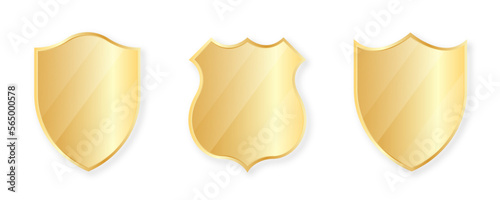Gold shields collection. Golden badges and labels in shield shape. Protection and security concept design element. Vector