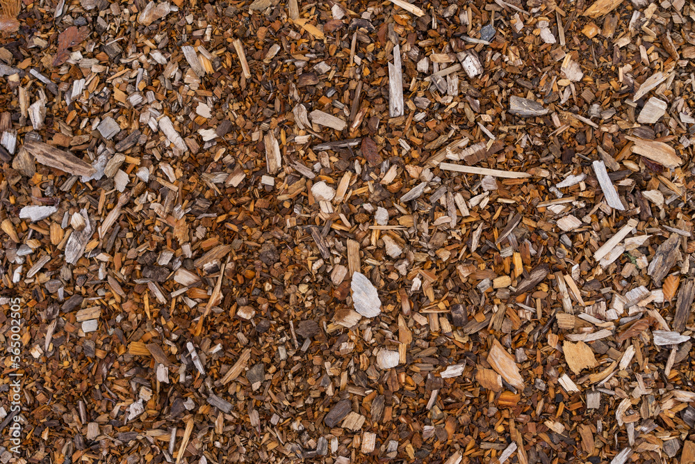 Mulch background. A pile of wood chips to be used as landscaping mulch. Mulch background. A pile of wood chips to be used as landscaping mulch.