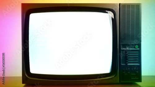 Vintage TV on colourful lights background, blinking screen and horizontal stripes on television display, bad satellite signal on antique TV, broken television with noise and bars interference on