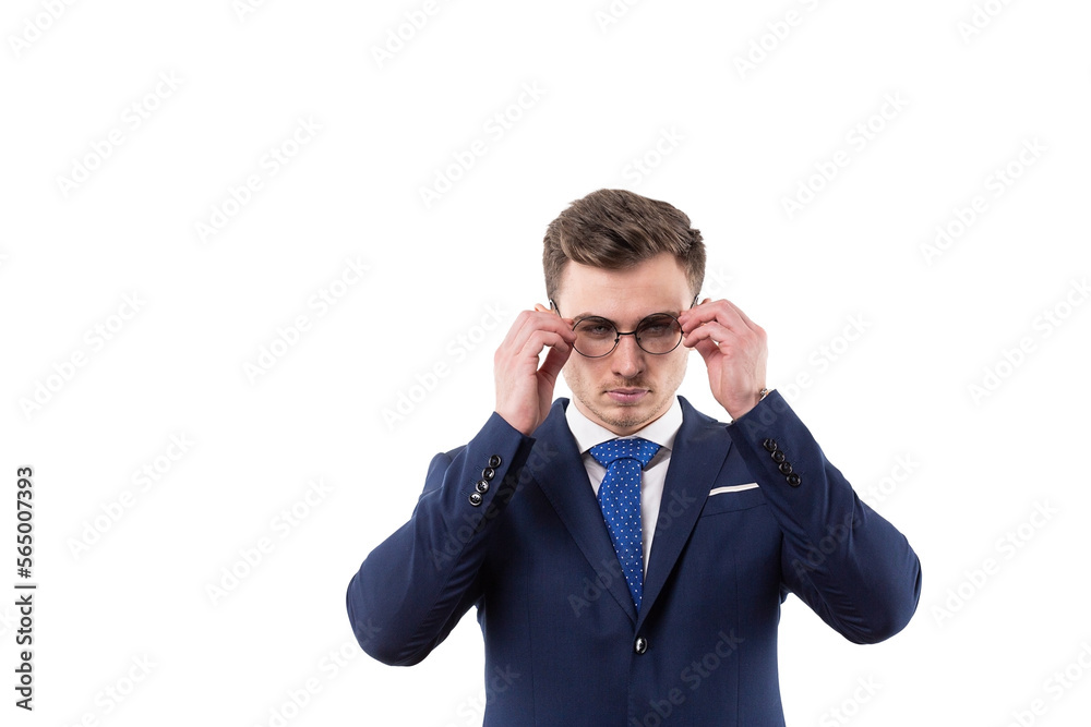 Handsome male businessman in a suit takes off his glasses and shows a gesture of prohibition. Concept in the studio on a white background. Handsome male businessman in a suit takes off his glasses and shows a gesture of prohibition. Concept in the studio on a white background.
