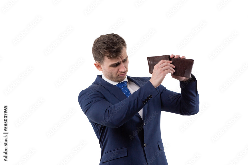 Handsome man in a suit turns over an empty wallet. Financial crisis and bankruptcy concept. In studio on a white background. Handsome man in a suit turns over an empty wallet. Financial crisis and bankruptcy concept. In studio on a white background.