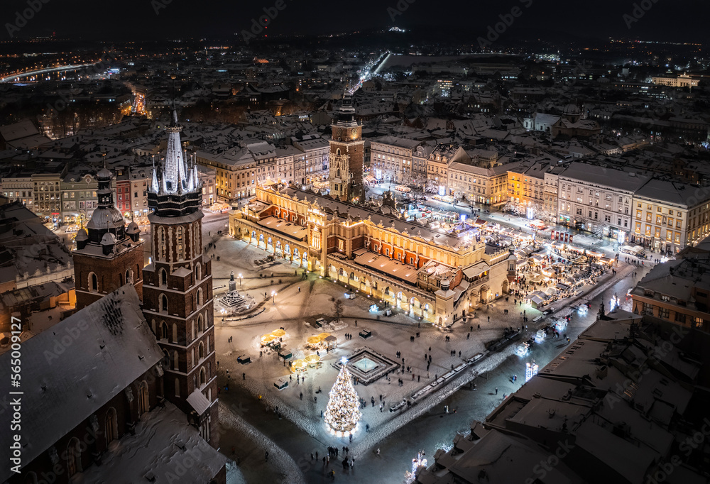 Christmas time on the Main Market Square (Saint Mary's Basilica, Sukiennice - Cloth Hall, Town Hall Tower) in Krakow, Poland