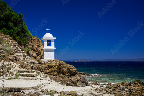 Greek chapel standing near to the steps by the sea in Agios Nikolaos, Kassandra, Greece