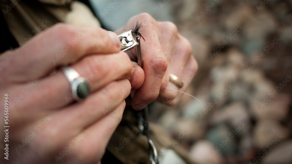 A young man in his early thirties  fly fishing near Durango, Colorado.