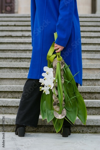 Girl in blue coat with flowers 
