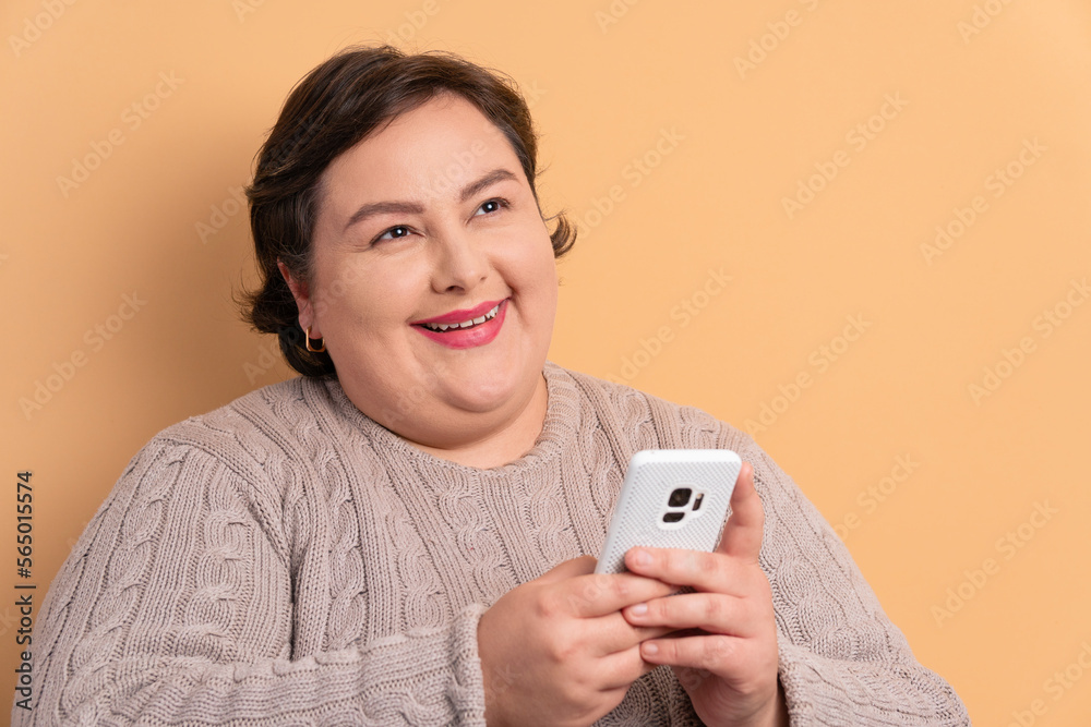 happy brazilian woman checking smartphone  in studio shot. app, social media, addiction, network concept.