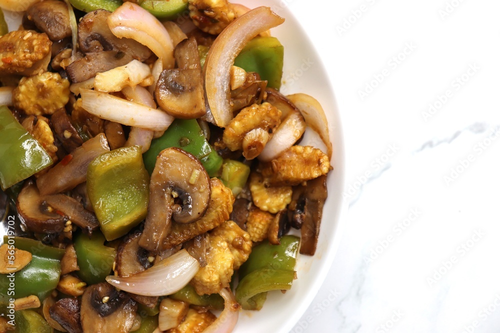 Fresh stir fried or sauteed vegetables. broccoli, zucchini, green and red peppers, mushrooms, onions, baby corn. colorful veggies in a white plate. Weightloss journey. Fitness concept. Healthy life. Fresh stir fried or sauteed vegetables. broccoli, zucchini, green and red peppers, mushrooms, onions, baby corn. colorful veggies in a white plate. Weightloss journey. Fitness concept. Healthy life.