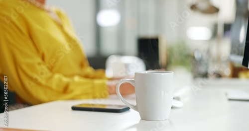 Coffee, business and black woman in office by computer working on sales or marketing project. Tea, pc or happy female employee or worker drinking espresso, cappuccino or caffeine in company workplace