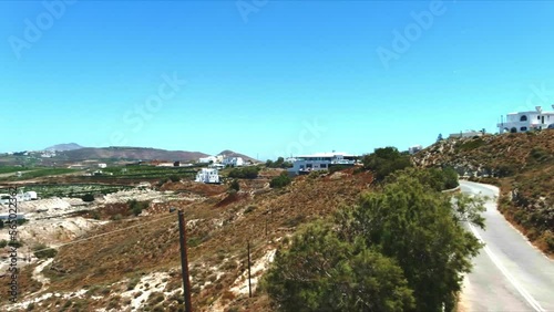 Aerial 4K Sky Top View Over Akra Mavro Vouno in Santorini Greece photo