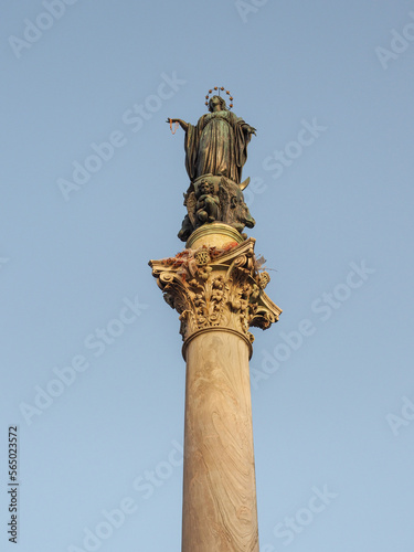 Marian monument, cipollino marble column with bronze statue of Blessed Virgin Mary on the top, known as Column of the Immaculate Conception or Colonna dell'Immacolata. Piazza Mignanelli square, Rome.