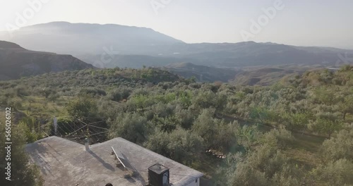 Drone shot of morning countryside and farmers house in Sierra Nevada Spain.
