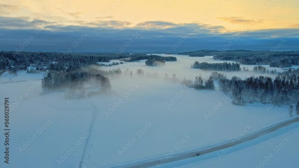 Foggy, snowy fields and forest on a beautiful winter morning sunrise Foggy, snowy fields and forest on a beautiful winter morning sunrise
