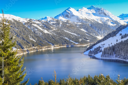 Alpine lake reservoir near Zillertal alps valley, Tyrol alps, Austria photo