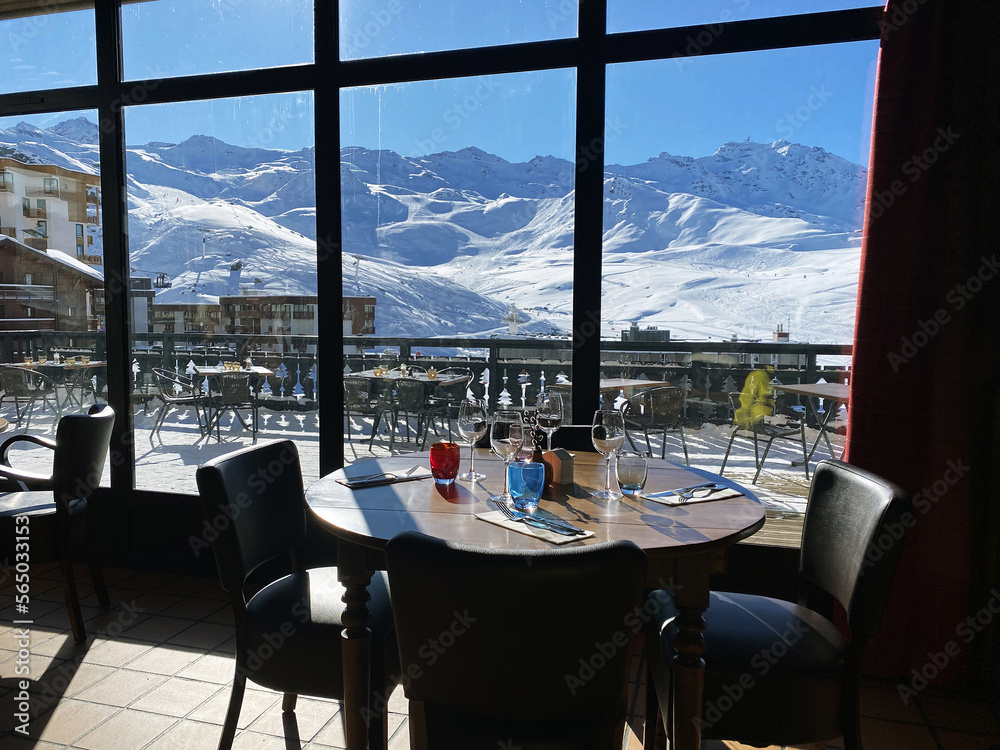 view from restaurant window of snow mountains of ski resort