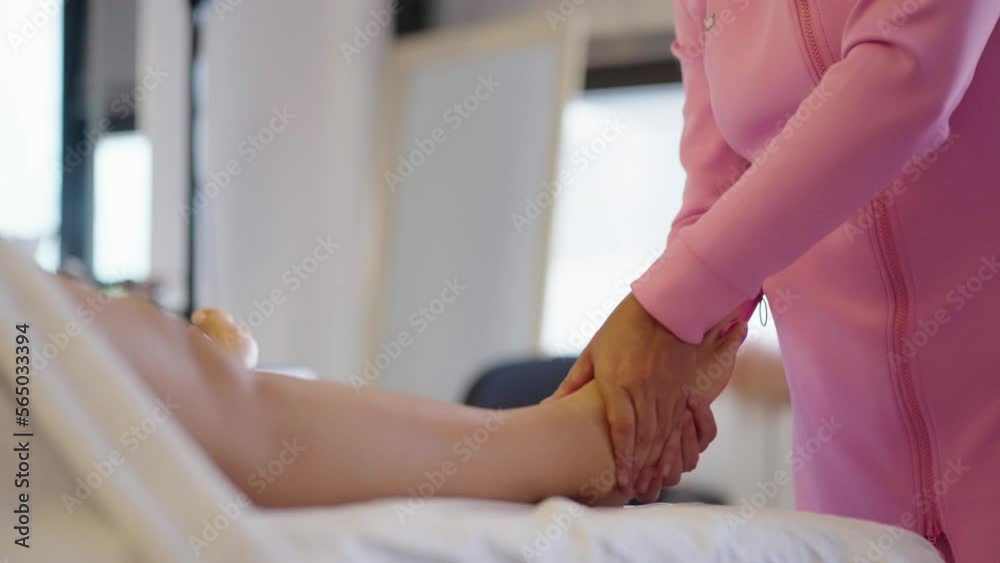 Woman gets feet massage in spa salon. Healthy lifestyle and body care concept. Woman gets feet massage in spa salon. Healthy lifestyle and body care concept.