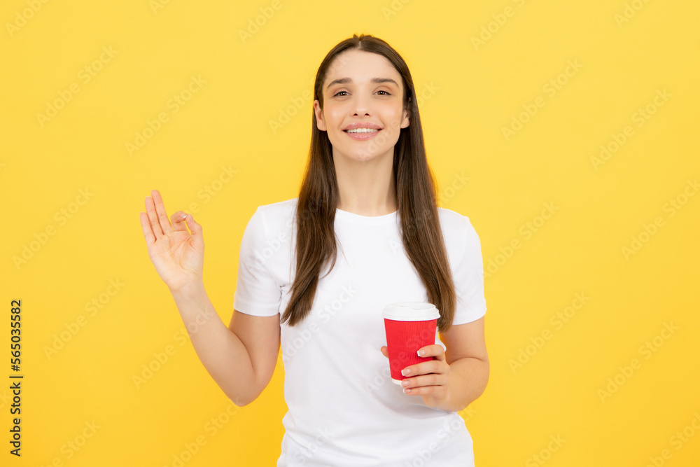 Beautiful young woman enjoying a cup of coffee while relaxing. People, drinks and leisure break, happy young woman with cup of tea or coffee. Beautiful young woman enjoying a cup of coffee while relaxing. People, drinks and leisure break, happy young woman with cup of tea or coffee.